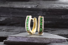 Load image into Gallery viewer, 14K Yellow Gold Huggie Earrings Set With Tsavorite Garnets And White Diamonds, View #4
