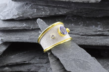 Load image into Gallery viewer, Lady's Two Tone 18 Karat Satin & Polished Contemporary Fashion Ring With 1 Oval Tanzanite And 2 Round Diamonds View #2