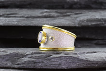 Load image into Gallery viewer, Lady's Two Tone 18 Karat Satin & Polished Contemporary Fashion Ring With 1 Oval Tanzanite And 2 Round Diamonds View #6