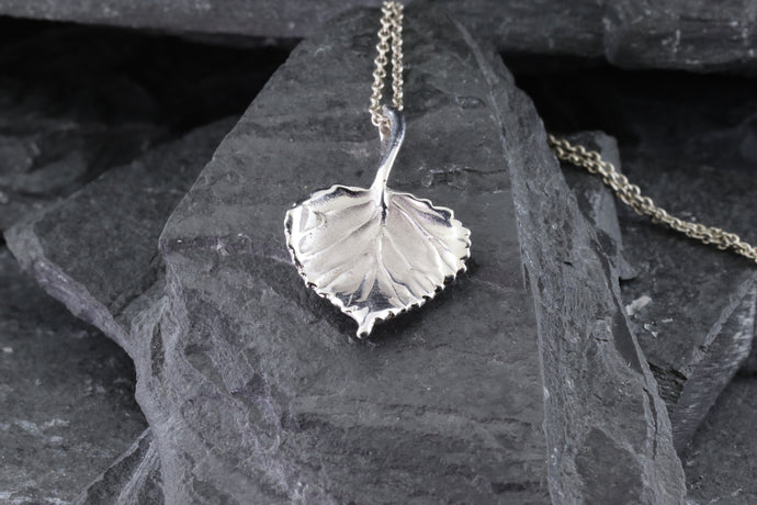  Cherish the elegance of nature with our exquisite 14K White Gold Aspen Leaf Pendant, intricately crafted to embody the grace of the Aspen tree. A perfect gift for someone special or a unique treat for yourself, this stunning piece represents growth, renewal, and resilience. The pendant comes with a matching 16