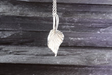 Load image into Gallery viewer, Cherish the elegance of nature with our exquisite 14K White Gold Aspen Leaf Pendant, intricately crafted to embody the grace of the Aspen tree. A perfect gift for someone special or a unique treat for yourself, this stunning piece represents growth, renewal, and resilience. The pendant comes with a matching 16&quot; 14K White Gold Chain, beautifully complementing the pendant&#39;s design.  Features:  Custom 14K White Gold Aspen Leaf Pendant 16&quot; 14K White Gold Chain View #2
