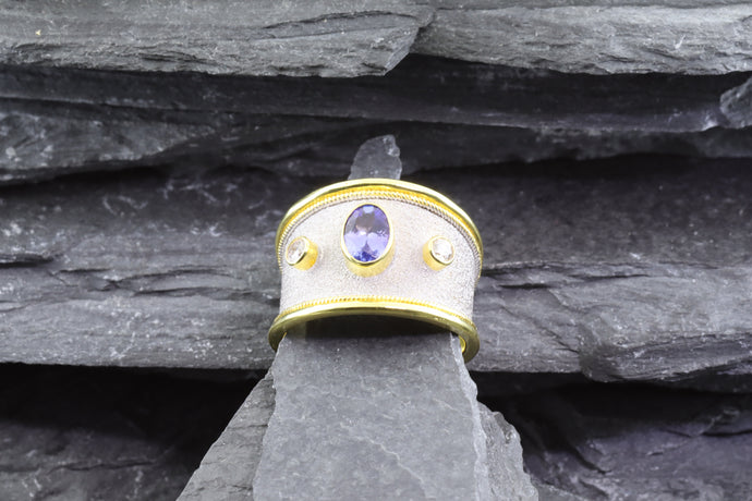 Lady's Two Tone 18 Karat Satin & Polished Contemporary Fashion Ring With 1 Oval Tanzanite And 2 Round Diamonds View #1