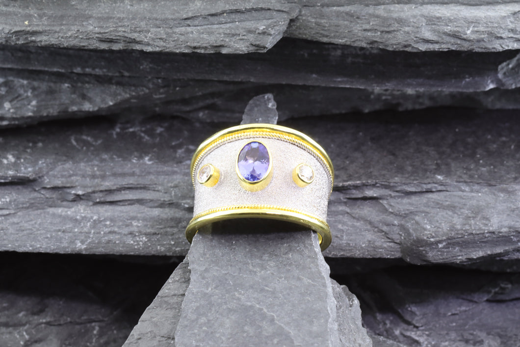 Lady's Two Tone 18 Karat Satin & Polished Contemporary Fashion Ring With 1 Oval Tanzanite And 2 Round Diamonds View #1