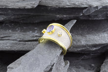Load image into Gallery viewer, Lady&#39;s Two Tone 18 Karat Satin &amp; Polished Contemporary Fashion Ring With 1 Oval Tanzanite And 2 Round Diamonds View #3
