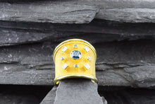 Load image into Gallery viewer, Lady&#39;s Yellow 18 Karat Satin &amp; Polished Contemporary Fashion Ring With Round Blue Diamonds And Princess Cut Diamonds, View #1
