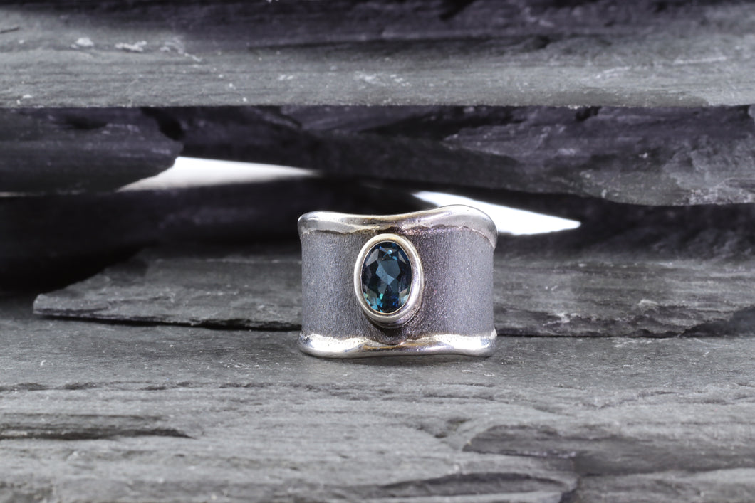 Sterling Silver & Satin Polished Oxidized Contemporary Ring With One Oval Blue Topaz., View #1