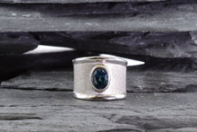 Load image into Gallery viewer, White Sterling Silver Satin &amp; Polished Contemporary Ring Bezel Set With One Oval Blue Topaz
