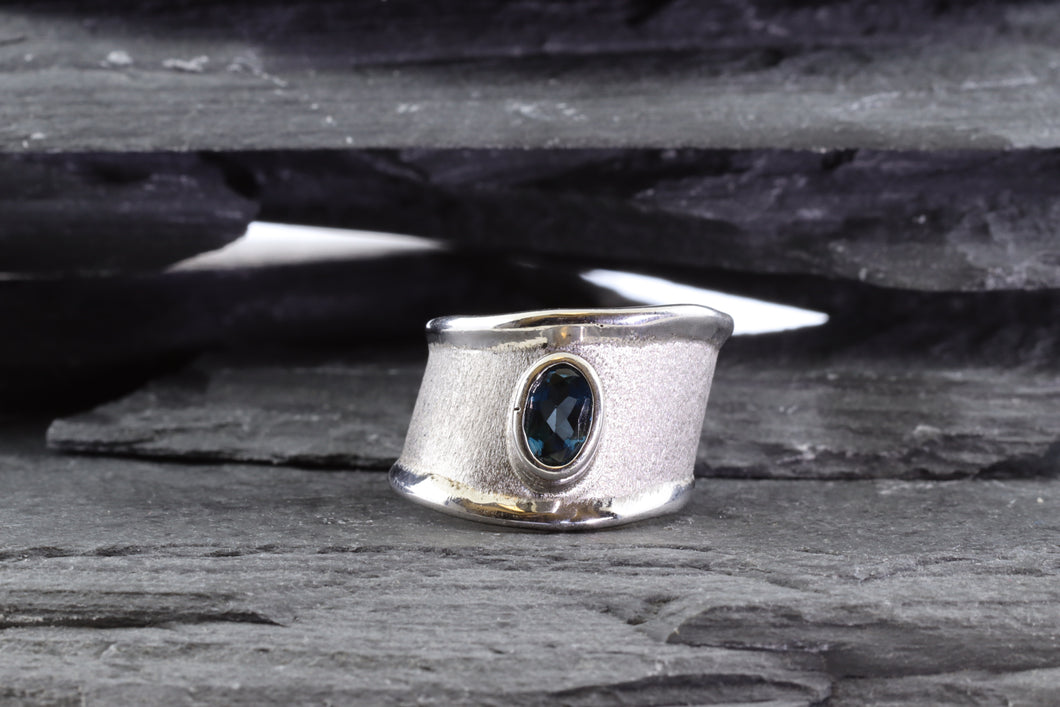 White Sterling Silver Satin & Polished Contemporary Ring With One Oval Blue Topaz., View #1