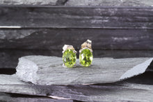 Load image into Gallery viewer, White Sterling Silver Stud Earrings With Oval Peridots, View #1
