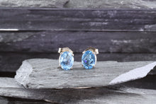 Load image into Gallery viewer, White Sterling Silver Stud Earrings With Two Trillion Blue Topaz, View #1
